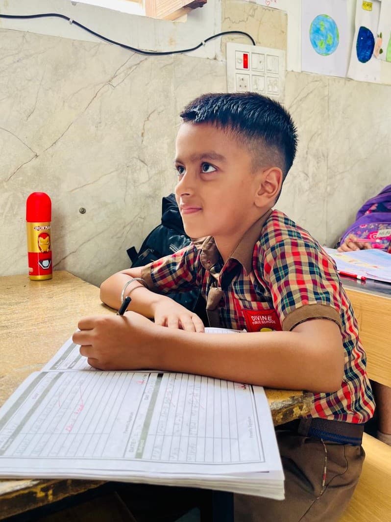 Students engaged in learning at Divine Public School